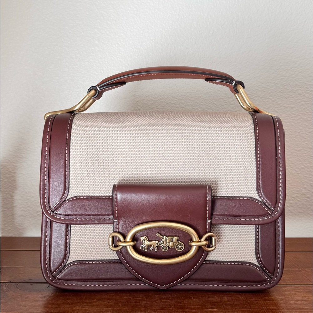 COACH Hero in Saddle